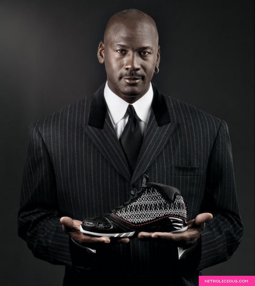 Michael Jordan holding Air Jordan XX3